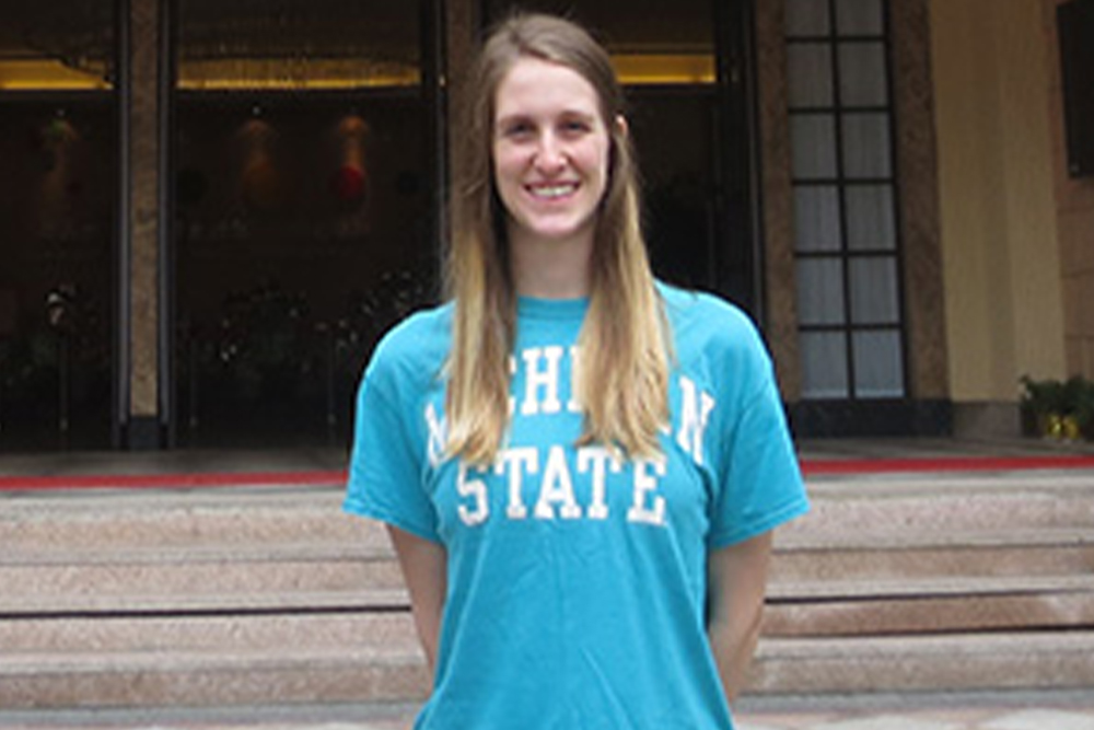 Woman with blonde hair in a blue shirt