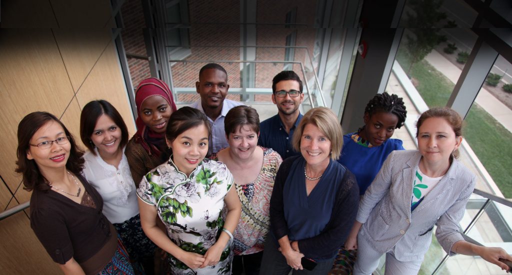 awarded educators pose for picture on staircase