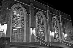 inside view of msu auditorium, black and white tiled flooring and large windows