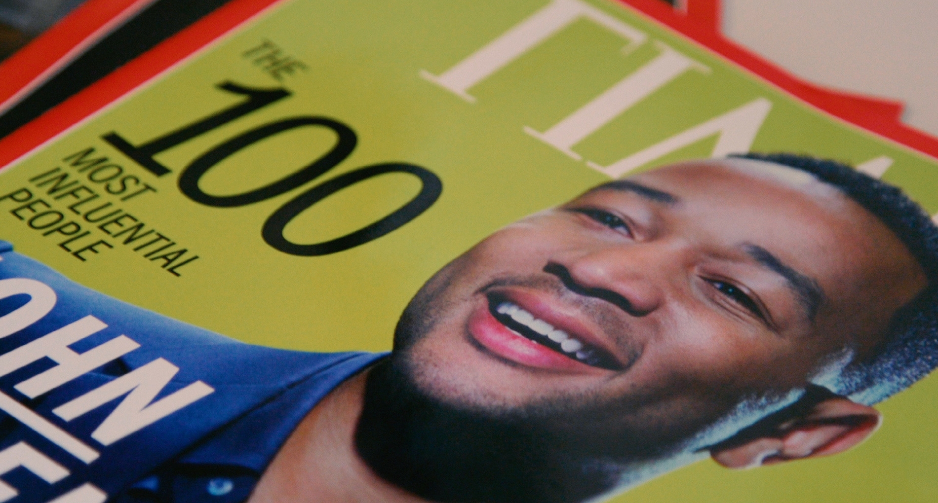 Green Time magazine cover with smiling man on it