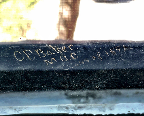 The name "CF Baker" etched on Linton Hall window ​.