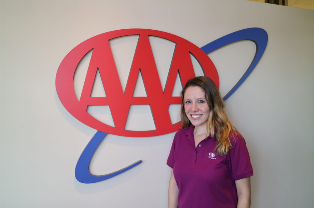 Caitlyn Gambino in front of AAA sign