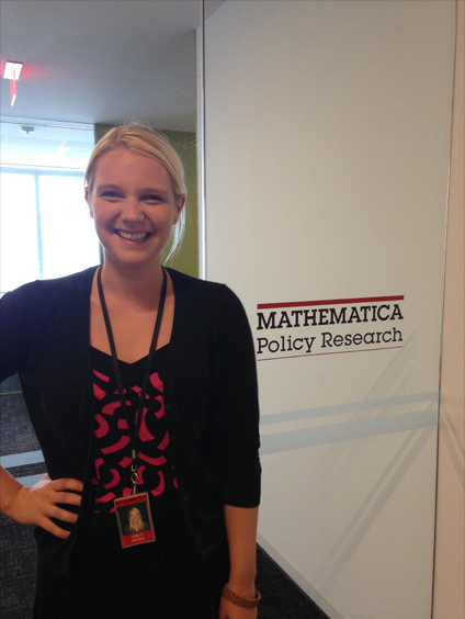 Emily Snoek in front of Mathematica Policy Research sign