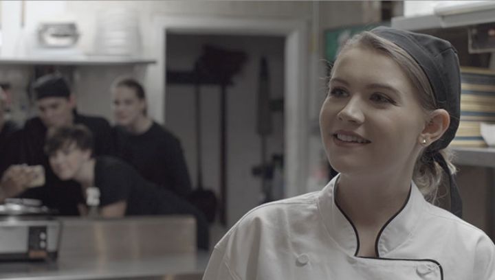 a girl in a chef costume 