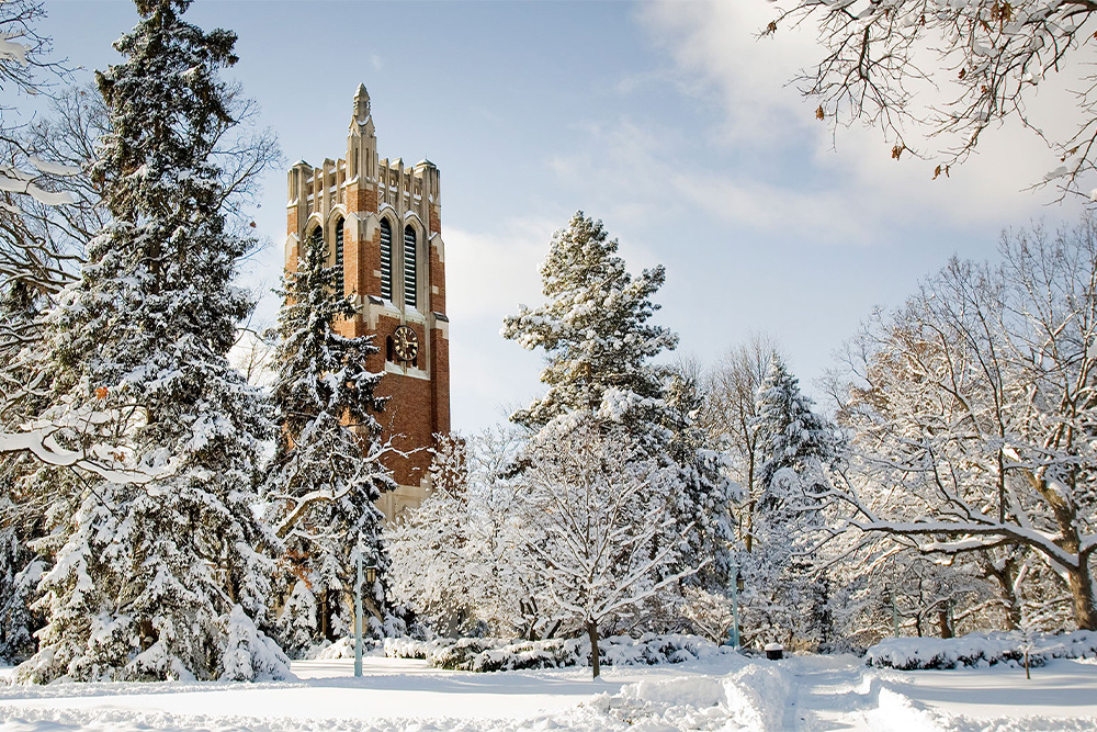 MSU's Beaumont tower in the winter surrounded by snow