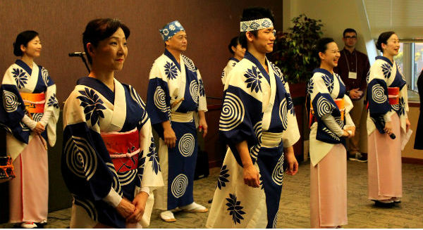 Japanese master artists in kimonos performing