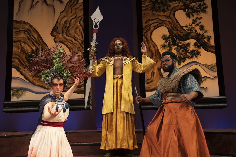 three people in fun costumes for a performance