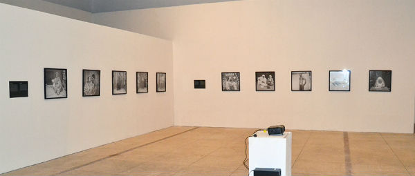 black and white photographs on white gallery walls
