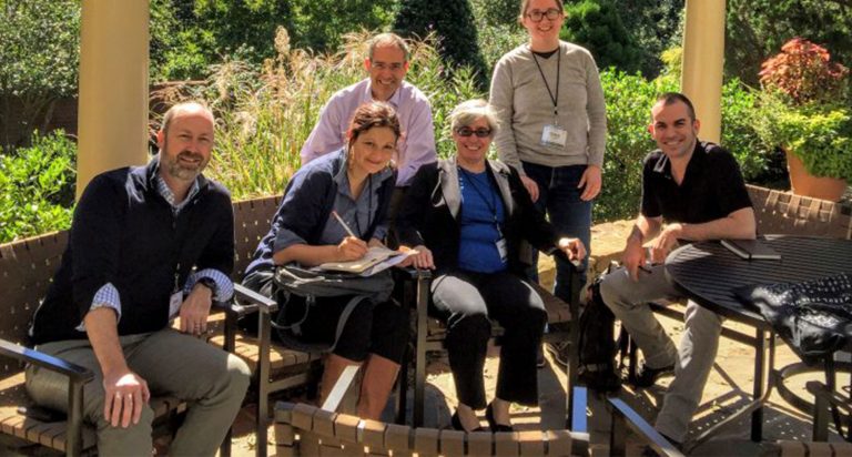 HuMetrics Participants sitting in outside gazebo