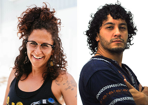 a man with curly hair and a blue shirt with a women with brown curly hair and a black tank top