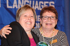 two women receiving an award