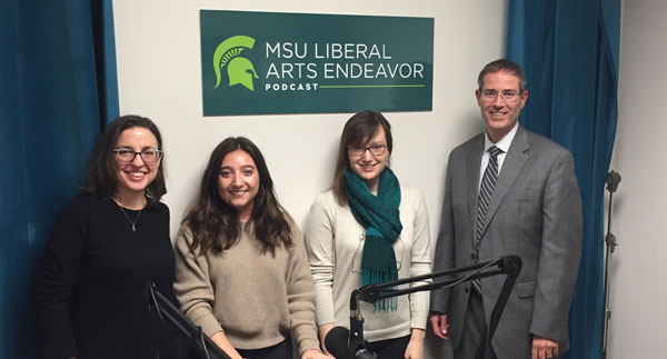 3 women and 1 man posing for a picture in the liberal arts endeavor podcast studio