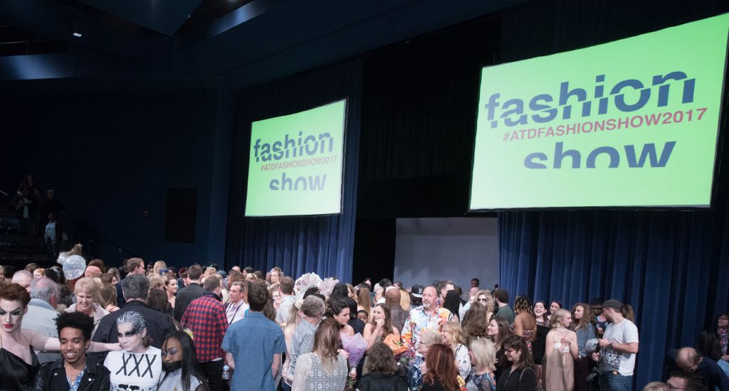 Designers, models, and attendees gathered on stage after the show