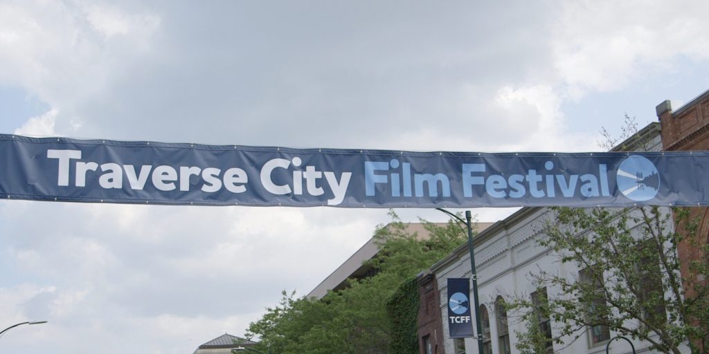 traverse city film festival banner hung above street