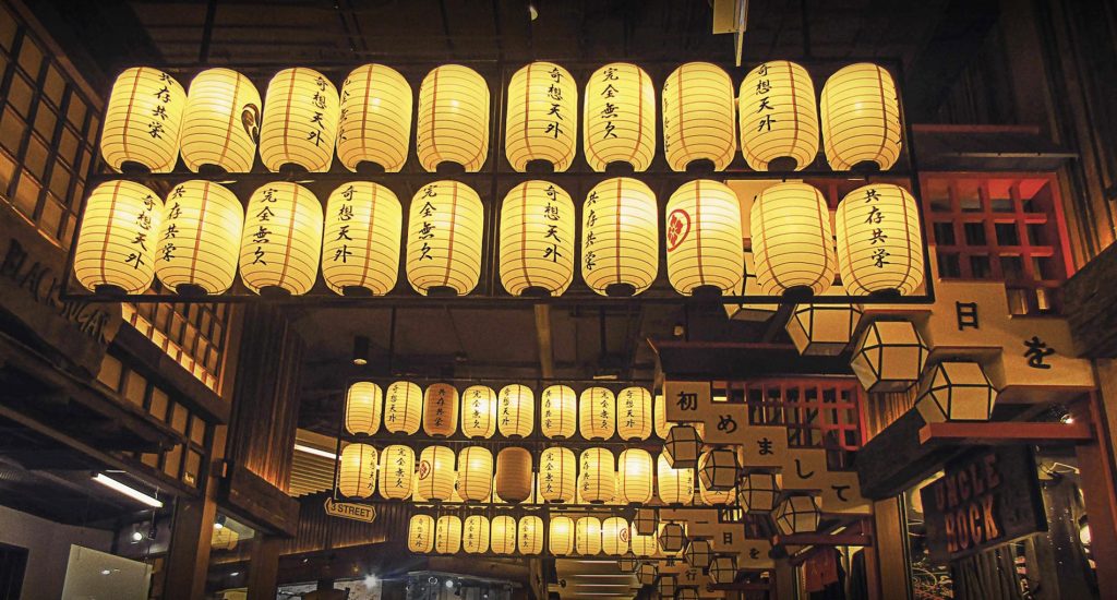 Japanese paper lanterns hanging above a street