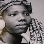 portrait photo of a women with a scarf around her head