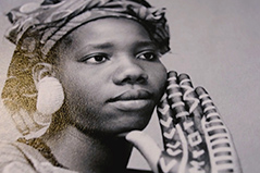 portrait photo of a women with a scarf around her head