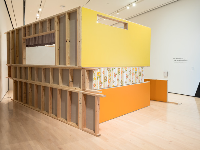 image of Laura's work at the broad, a structure made out of wood with yellow and orange paint and a flower pattern