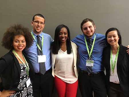 students and faculty pose for a picture at NCTE convention