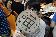 a girl holding a a Chinese paper fan