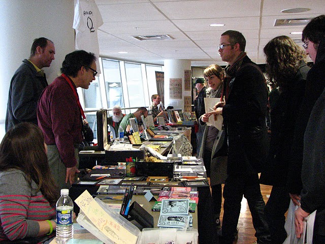 people at comics forum tables