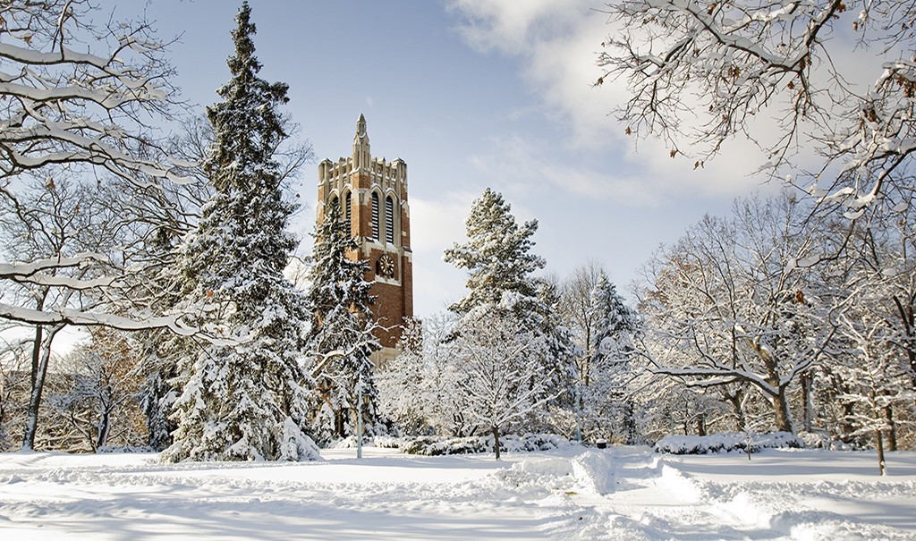 MSU clock tower in the winter surrounded by snow