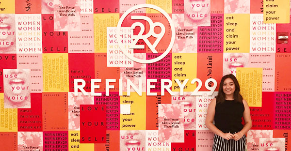 girl in front of Refinery29 sign