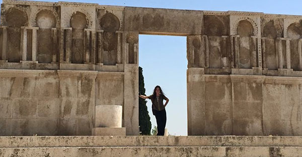 woman standing in old architecture doorway in Jordan