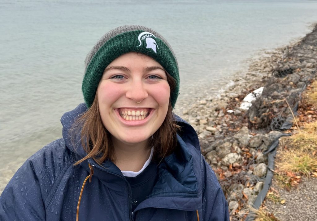 Headshot photo of Julianna Bruno, who is wearing a knit hat with the MSU Spartan logo.