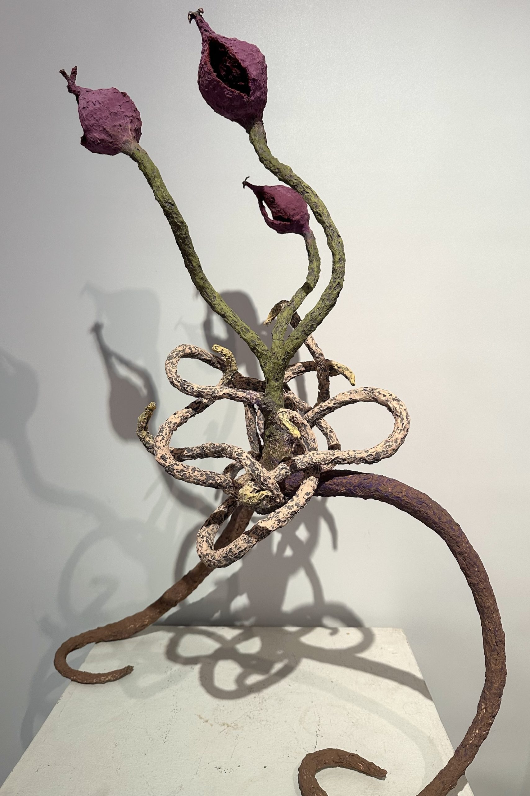 Photo of Mackenzie Sheehan-D'Arrigo's sculpture of a budding plant walking on its roots.