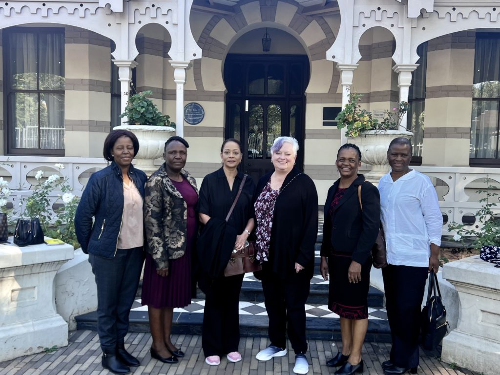 A photograph of GALE director Trixie Smith with colleagues in Africa