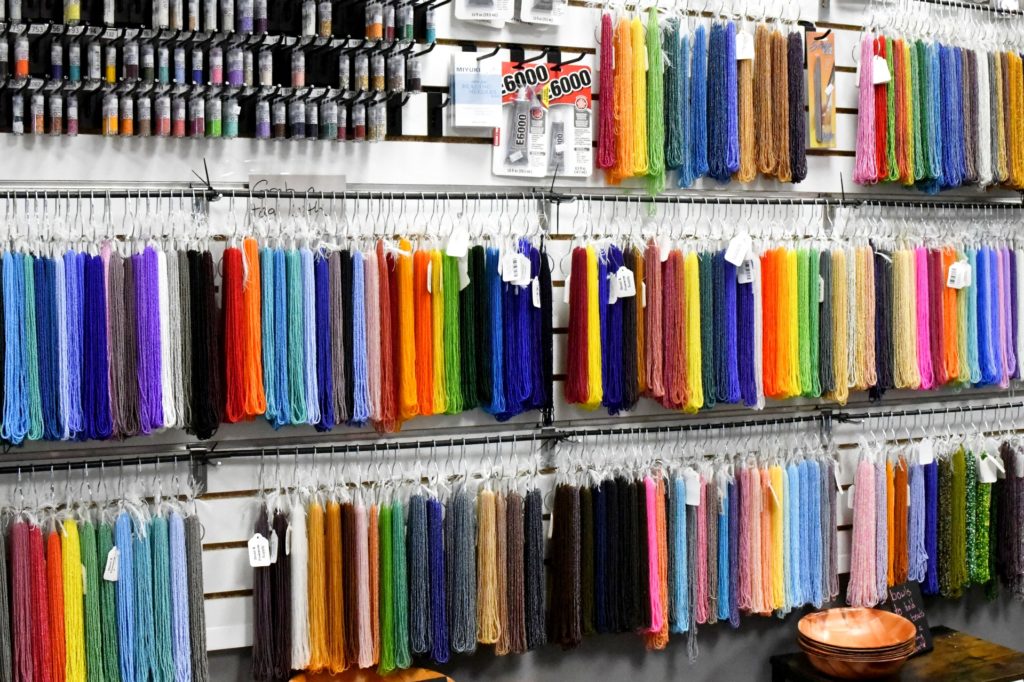 a display in a store showing hundreds of brightly colored beads. 