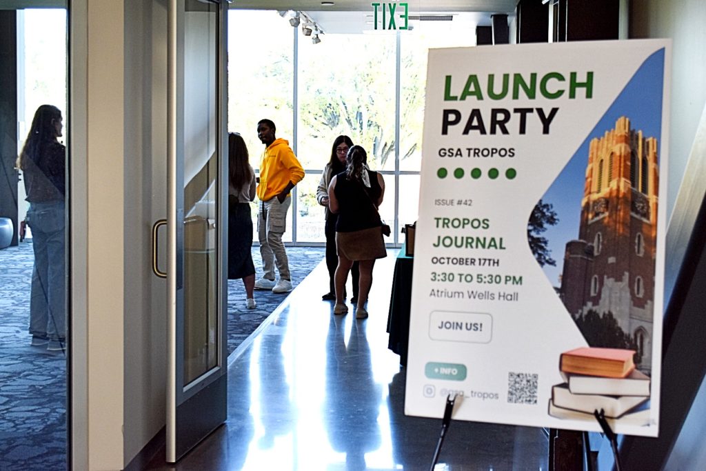 The entrance to the TROPOS launch party where there is a sign that says: "Launch Party GSA TROPO Issue #42 TROPOS Journal October 17th 3:30 to 5:30 PM Atrium Well Hall Join Us"