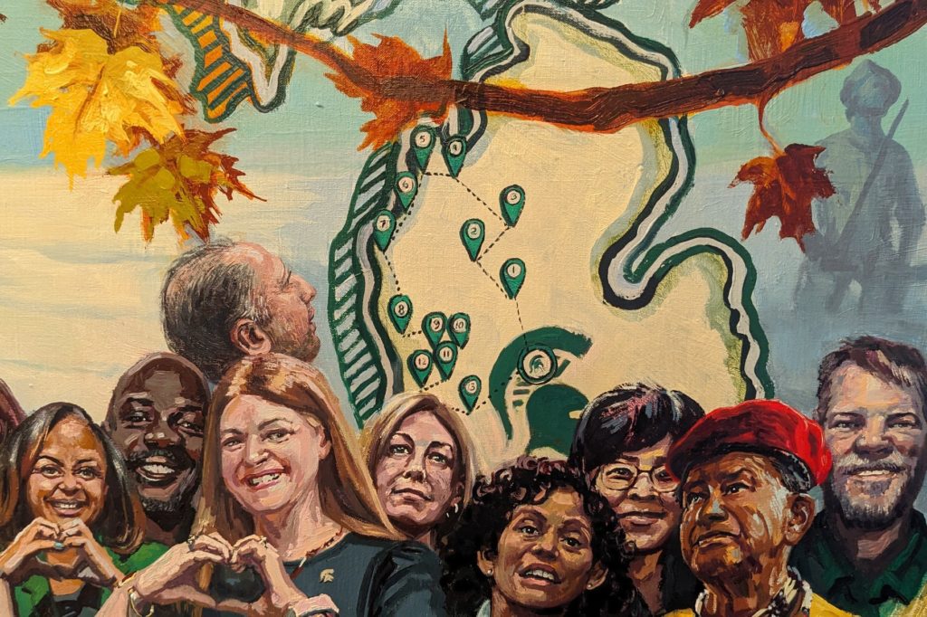 Part of the larger painting that shows a group nine people standing in front of an image of the state of Michigan. 